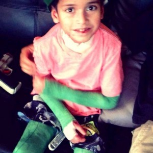 Samuel with green bandages.